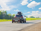 car pulling a trailer during a one-way move