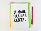 Notepad reading &quot;U-Haul Trailer Rental&quot;